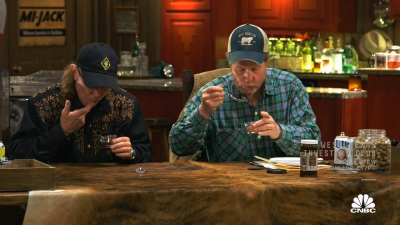 The investors testing out Jack's jelly sauce.
